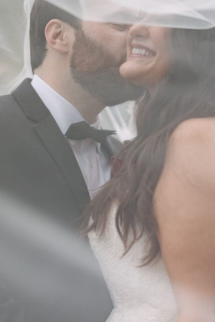 Editorial wedding Portrait of veil over bride and groom